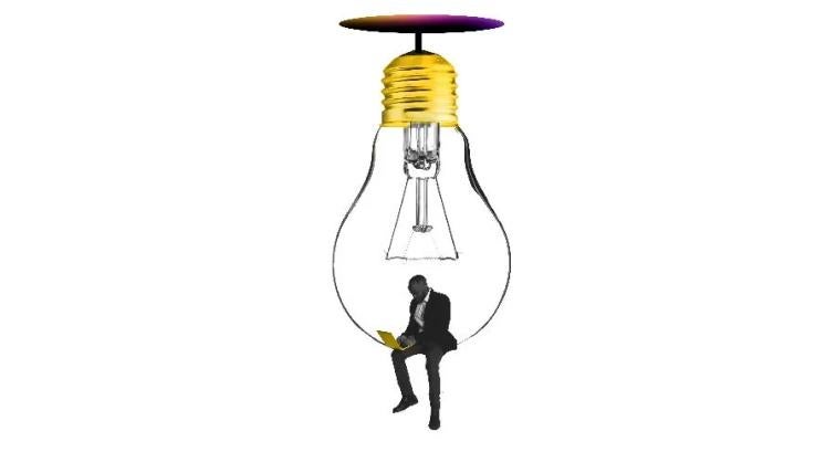 Branded image with a businessman on a laptop, perched in a lightbulb