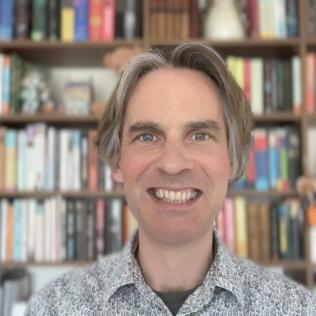The headshot of Barney Brown, Head of Digital Communications at University of Cambridge 
