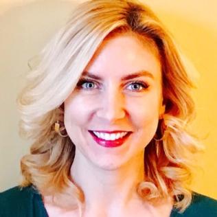 Image of Kate in front of a yellow background. 