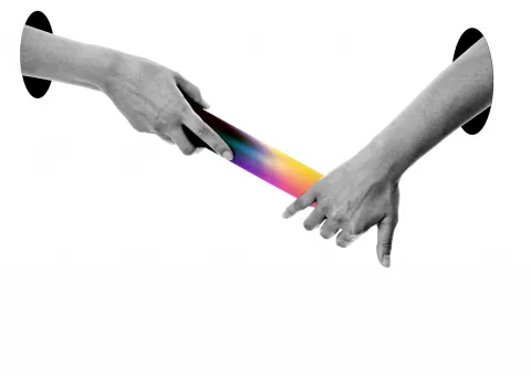 Hands passing a multicolored baton